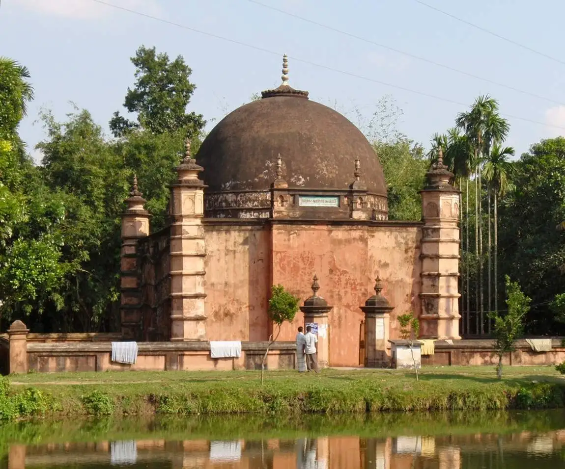 The village Jame Mosque beside its pond.